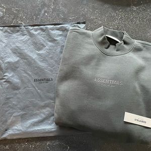 Size Medium. Brand new Essentials Relaxed crew neck in OFF BLACK color.